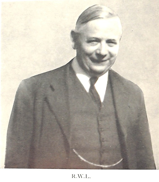 A smiling portrait of Richard Ladborough with watchchain